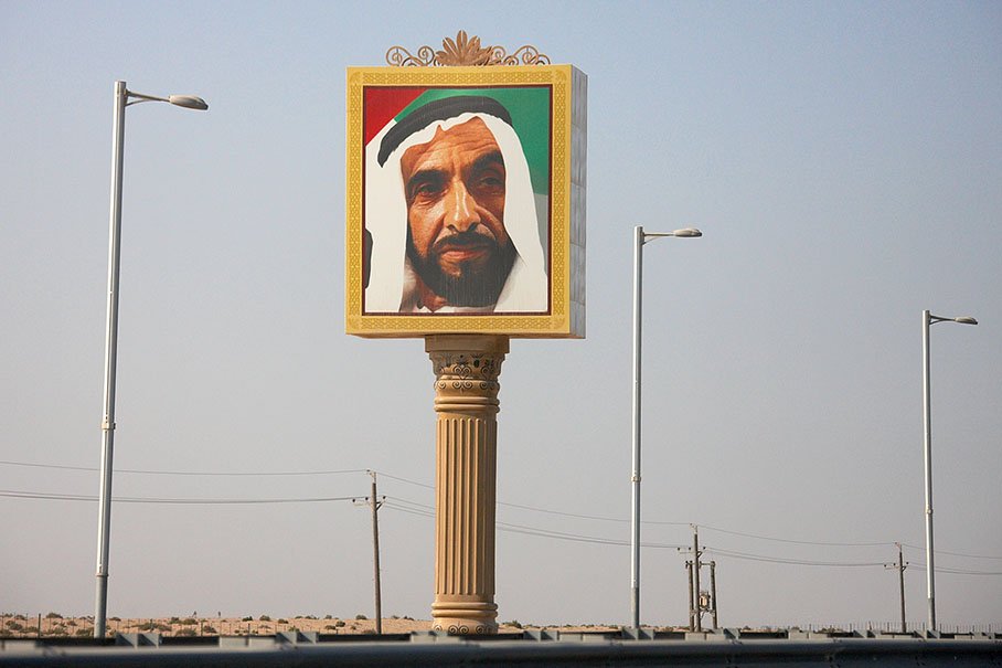 The portrait of a sheikh on a greek post welcomes the visitor: His Highness Sheikh Zayed bin Sultan Al Nahyan, the deceased ruler of Abu Dhabi and president of the UAE for over 30 years (1971-2004)