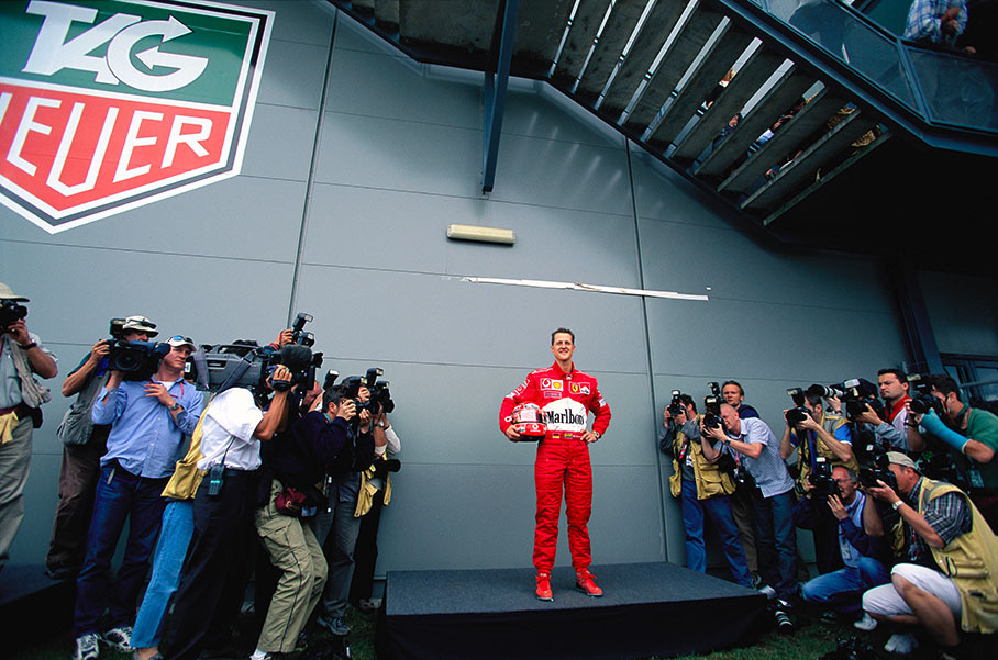 Michael Schumacher poses for the annual drivers shooting