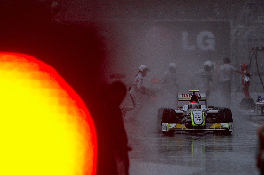 Rubens Barrichello, Brawn Grand Prix, in a rain-swept pitlane