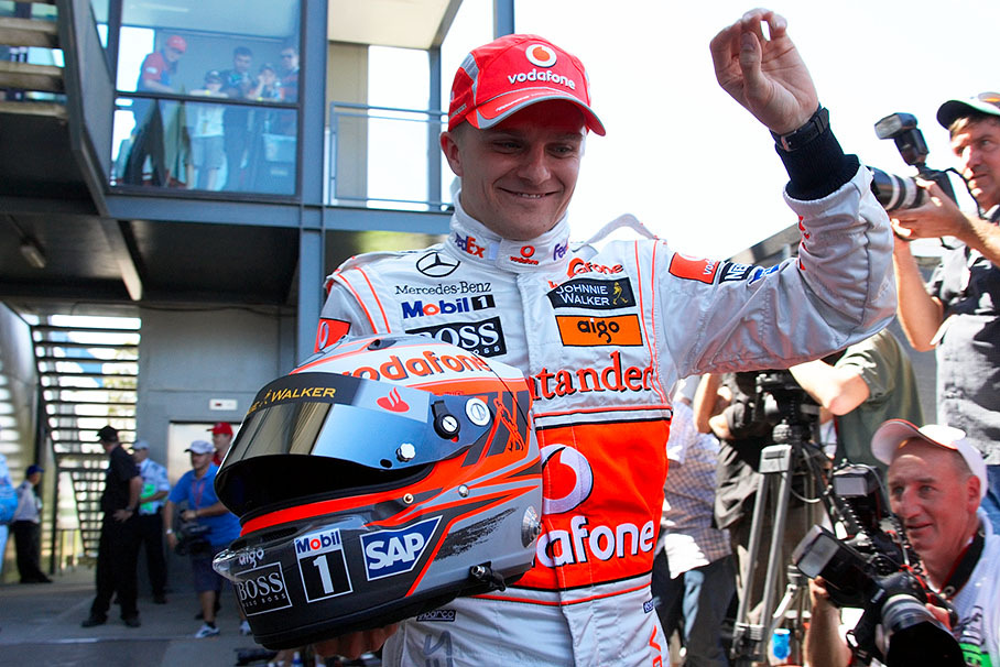 New McLaren driver Heikki Kovalainen leaves the drivers presentation with a smile