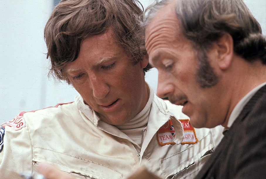 Jochen Rindt discusses times with Lotus team principal Colin Chapman