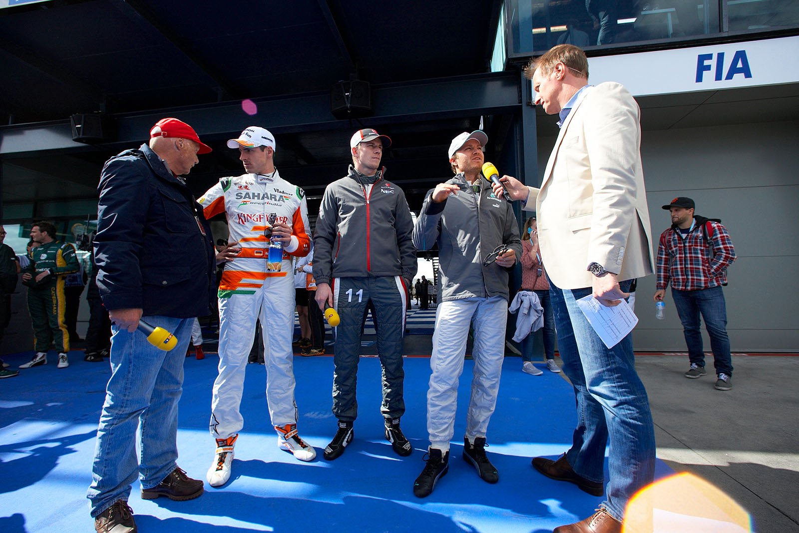 Three German drivers - Adrian Sutil, Nico Huelkenberg and Nico Rosberg - are interviewed by the RTL TV presenters Niki Lauda and Florian Koenig
