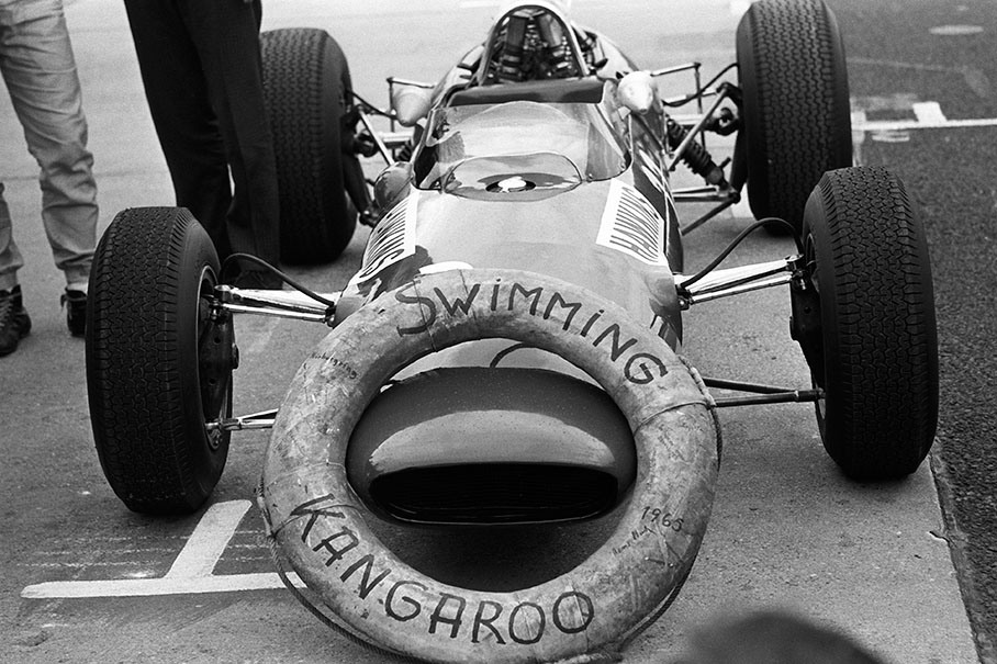 Car of the Australian "Swimming Kangaroo" Paul Hawkins who is being made fun of by his colleagues at the German GP - because of his harbor bath by accident in Monaco that year in his ex-works Lotus 33, entered by privateer Dickie Stoop.