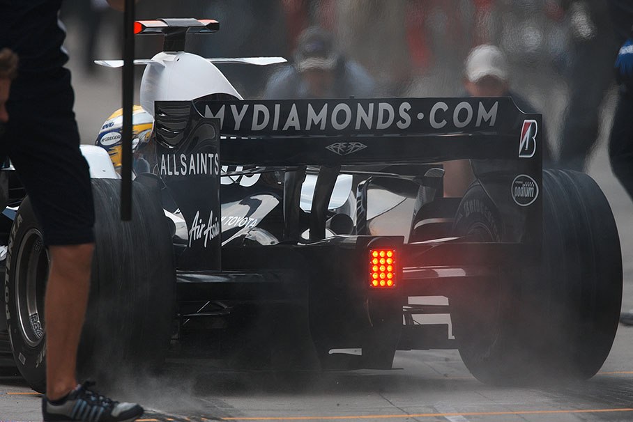 Nico Rosberg puts rubber on the pitlane at Williams pits