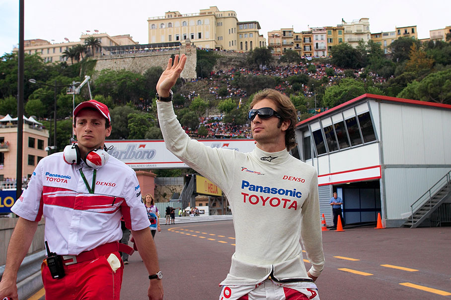 Jarno Trulli waves at spectators