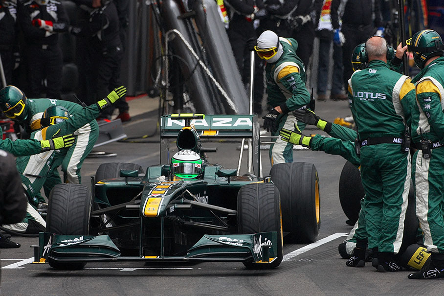 Heikki Kovalainen clears Lotus Racing pits