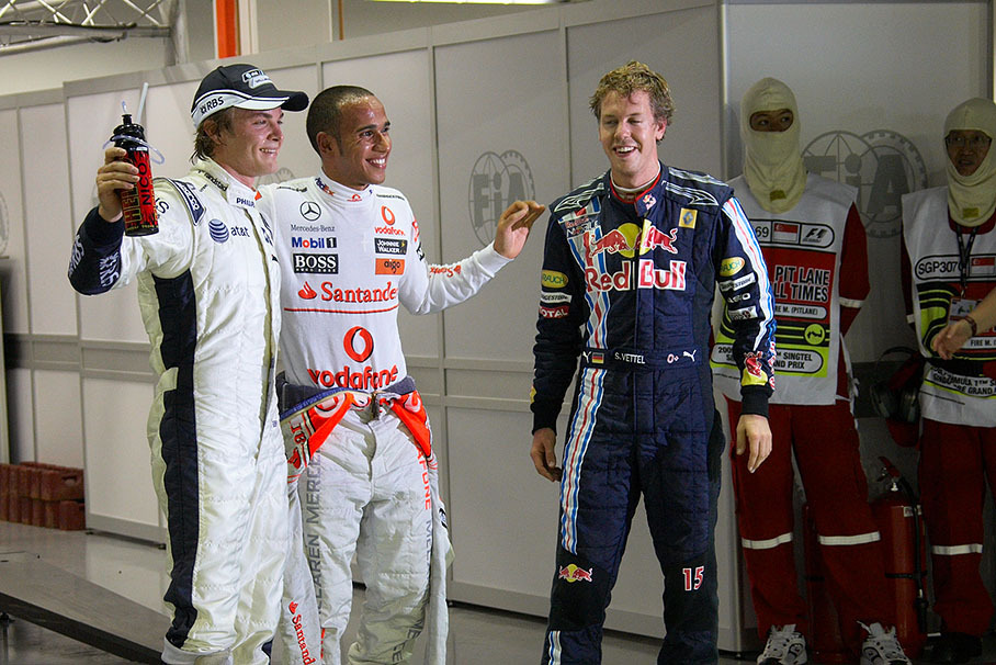 The fastest three qualifiers pose in parc ferme for the media after qualifying: Third grid placed Nico Rosberg, polesitter Lewis Hamilton and second qualifier Sebastian Vettel
