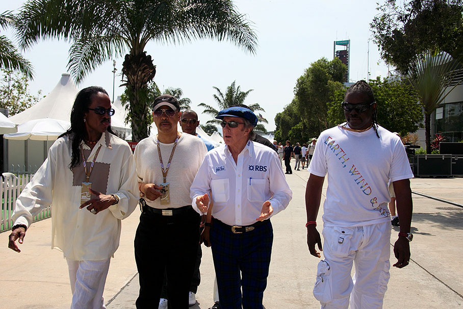 Jackie Stewart explains F1 to his VIP guests, members of the legendary band 'Earth, Wind &amp; Fire'