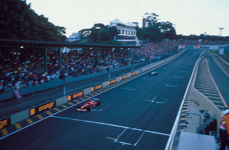 Michael Schumacher on the pace through the arena, brother Ralf shortbehind