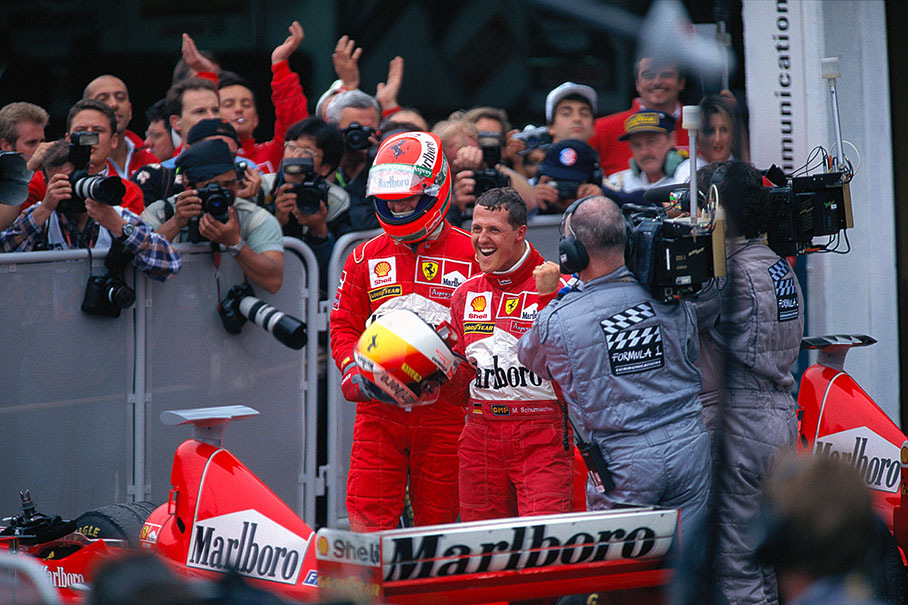 Argentine GP 1998: Michael Schumacher and Ferrari team-mate Eddie Irvine after a one-three finish