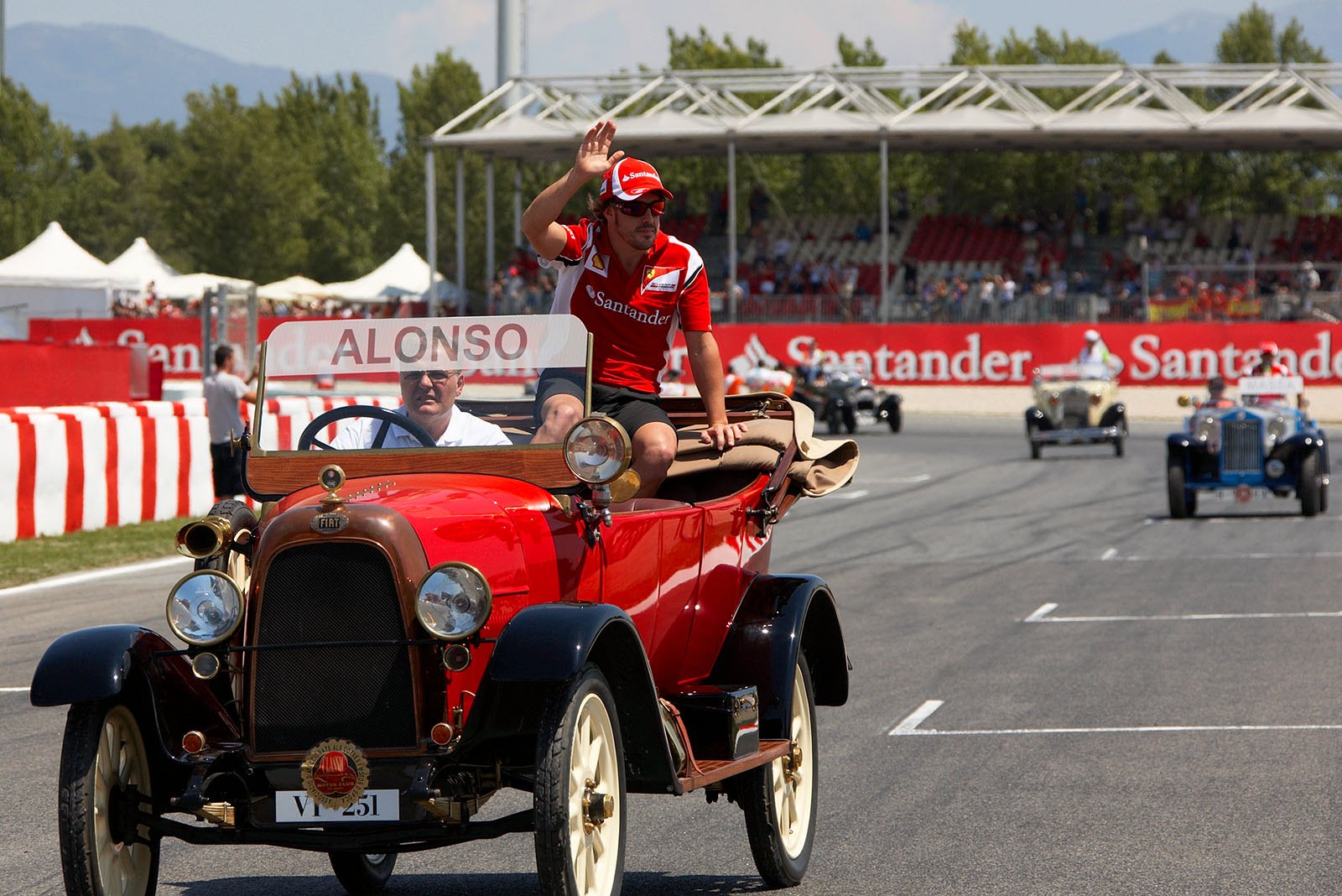 Local hero Fernando Alonso greets the fans during the drivers' parade.