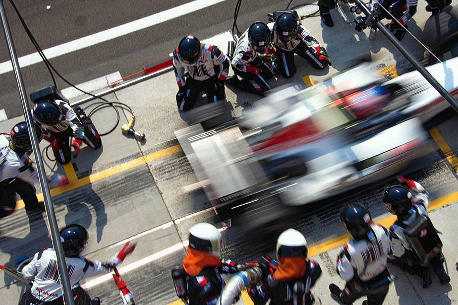Jenson Button of BAR-Honda speeding out of the pits after his stop for refuling.