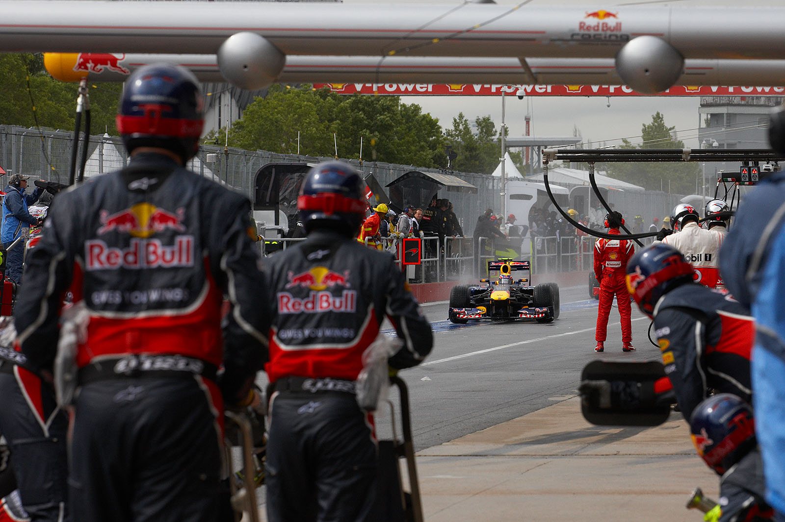 Mark Webber comes for a change to intermediate tyres to Red Bull pits