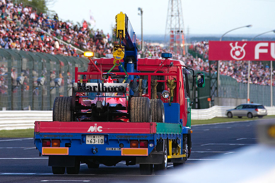 Michael Schumacher's Ferrari being returned after the race
