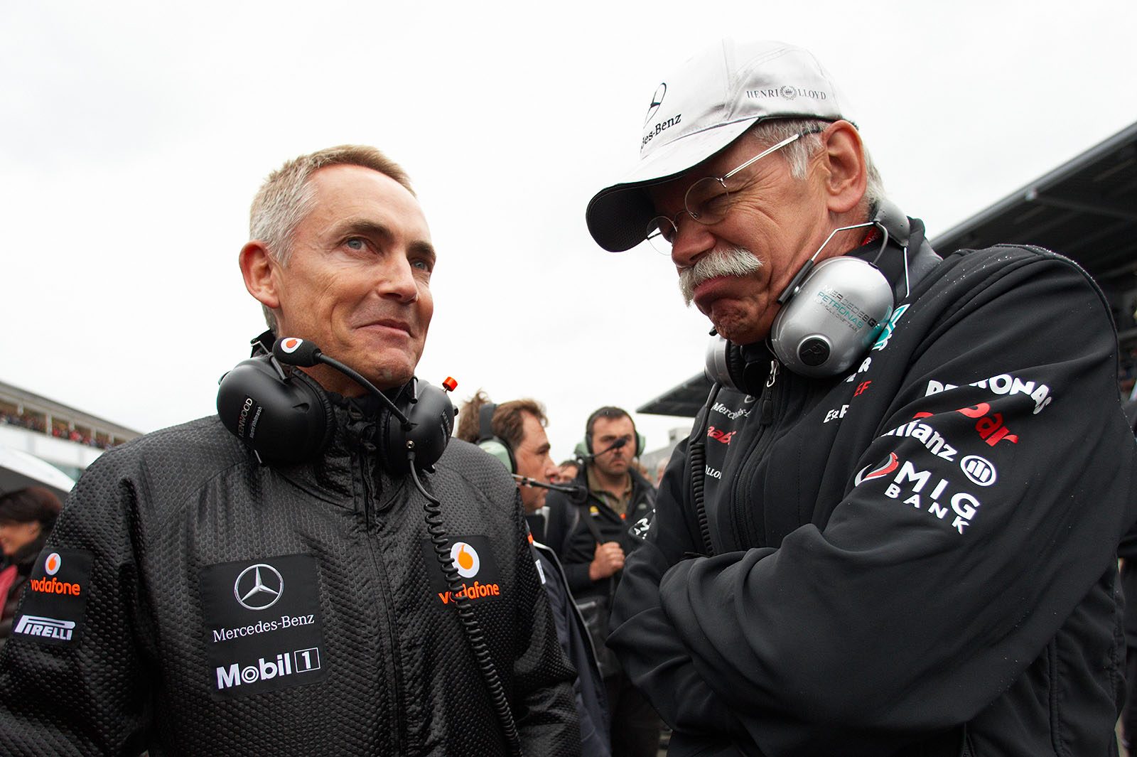 McLaren team principal Martin Whitmarsh chats on the grid with Mercedes chairman of the board Dieter Zetsche