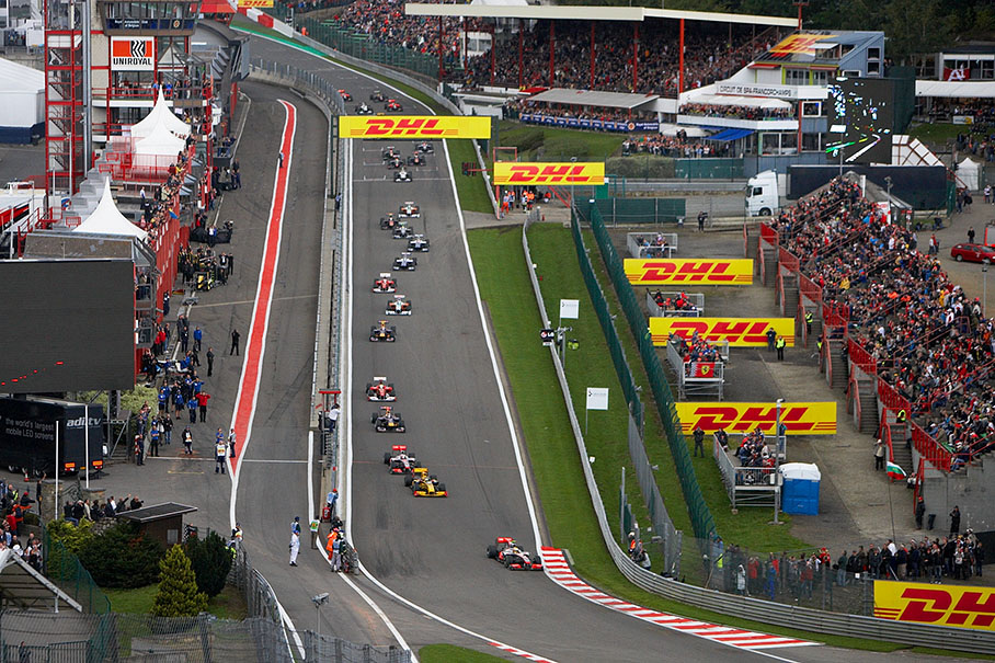 Lewis Hamilton leads the start field into Eau Rouge's chicane in front of Renault's Kubica and McLaren team mate Button