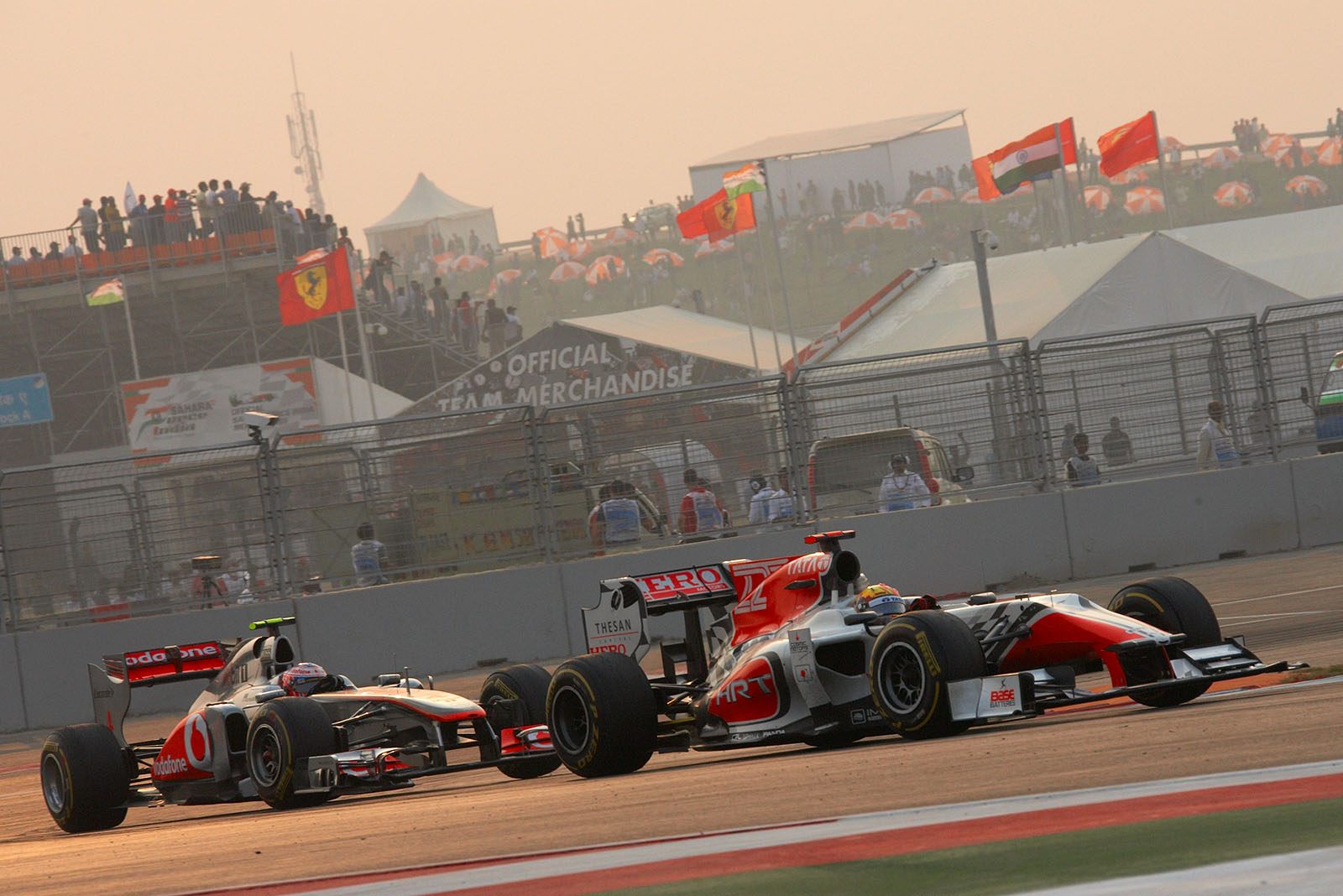 Narain Karthikeyan, HRT, in front of Button's McLaren