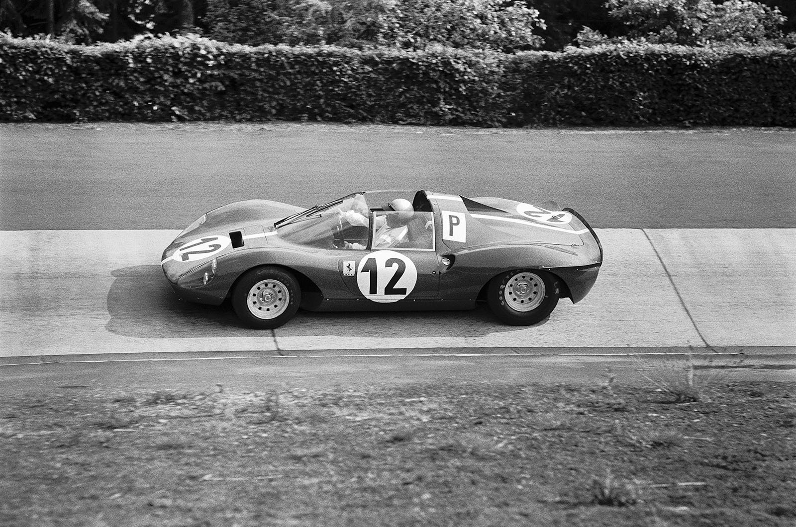 The Ferrari Dino 206 S #008 driven by Richie Ginther (USA), at the wheel, and Pedro Rodriguez (MEX)