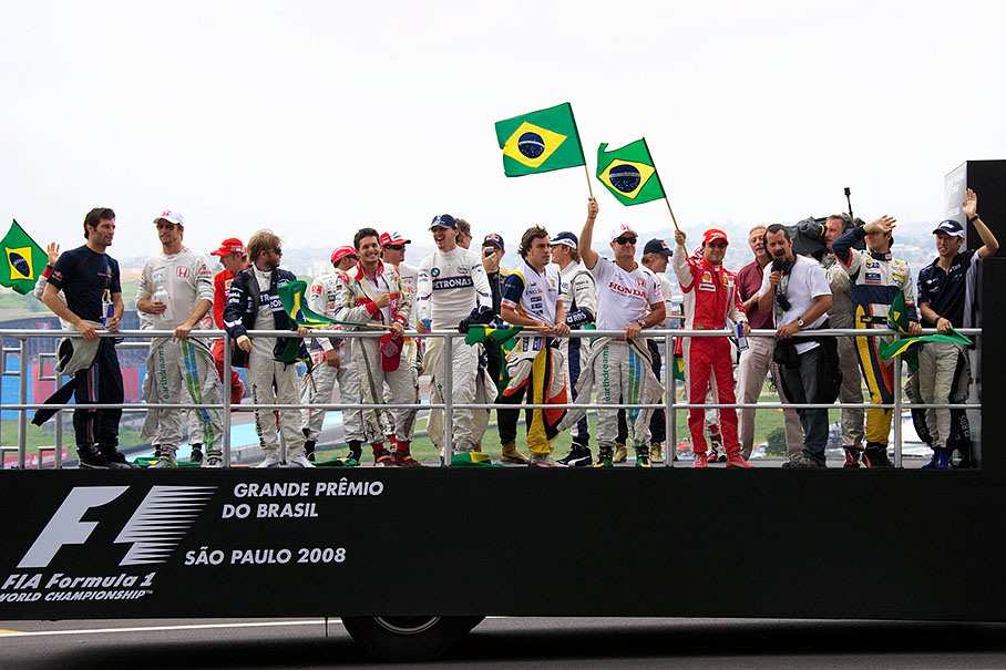 During drivers parade some of the drivers greet the fans with the Brazilian national banner