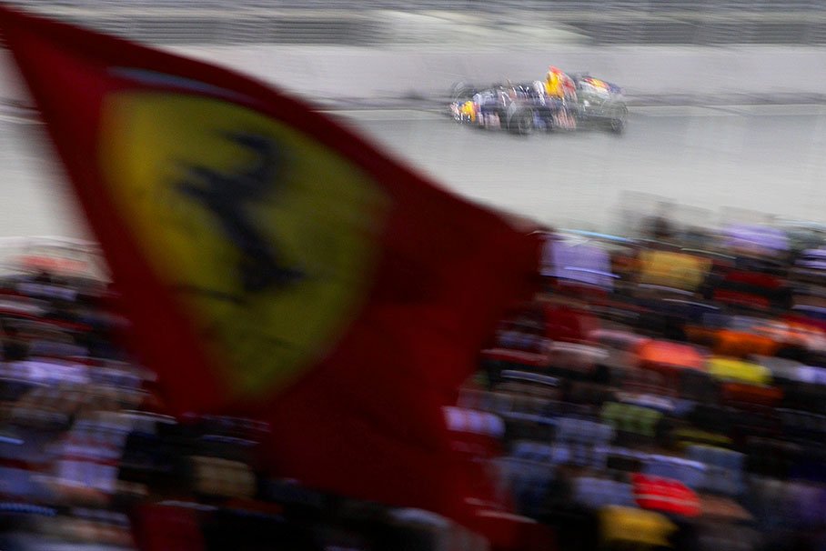 Red Bull's David Coulthard passes Marina Bay Gallery grandstand