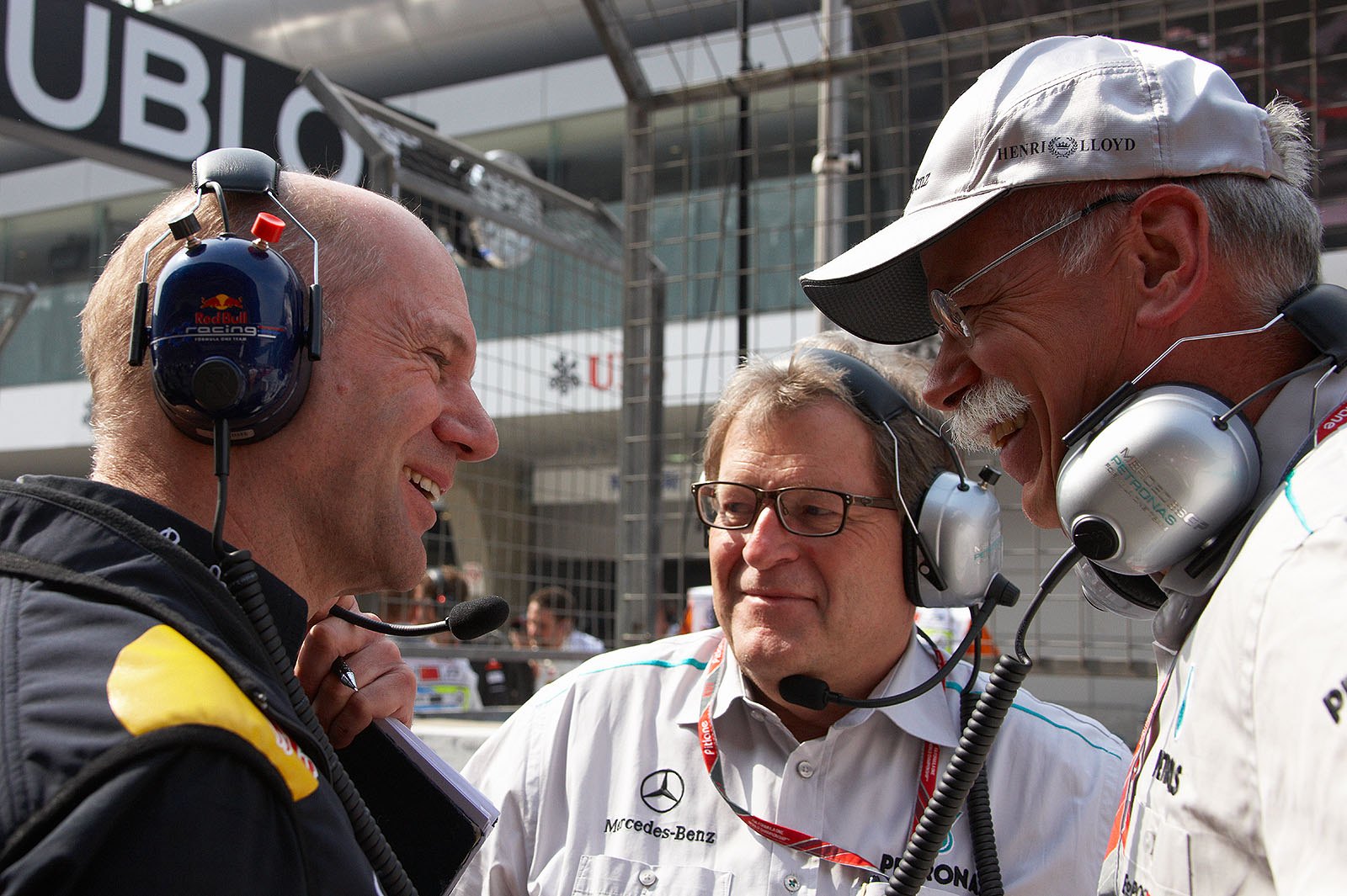 Red Bull technical director Adrian Newey chats on the grid with Mercedes Sporting Director Norbert Haug and Daimler chairman Dr. Dieter Zetsche