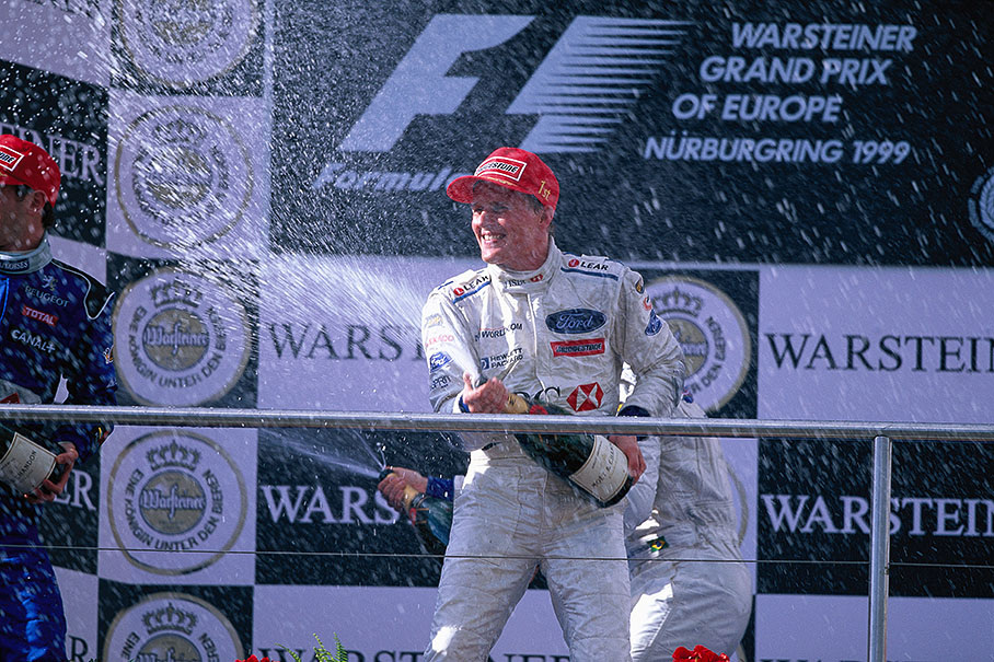 Winner Johnny Herbert sprays champagne on European Grand Prix podium