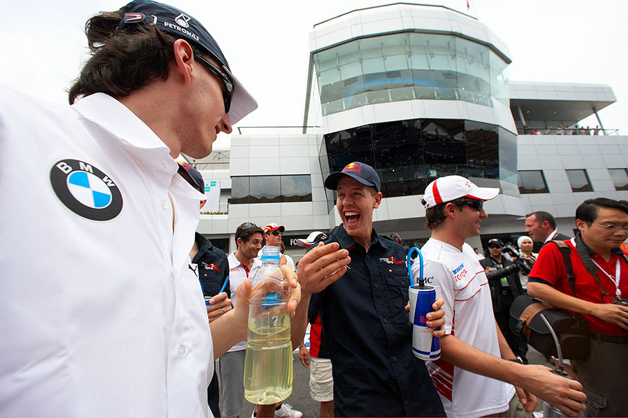 Youngster Sebastian Vettel teases Kubica about the surprised expression on his face when he was suddenly stopped by a bodyguard