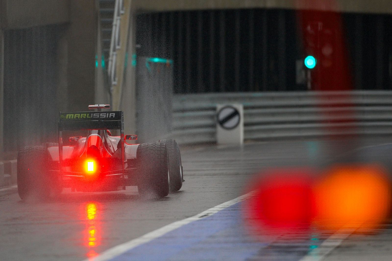 Timo Glock, Virgin Racing, approaches pit lane exit