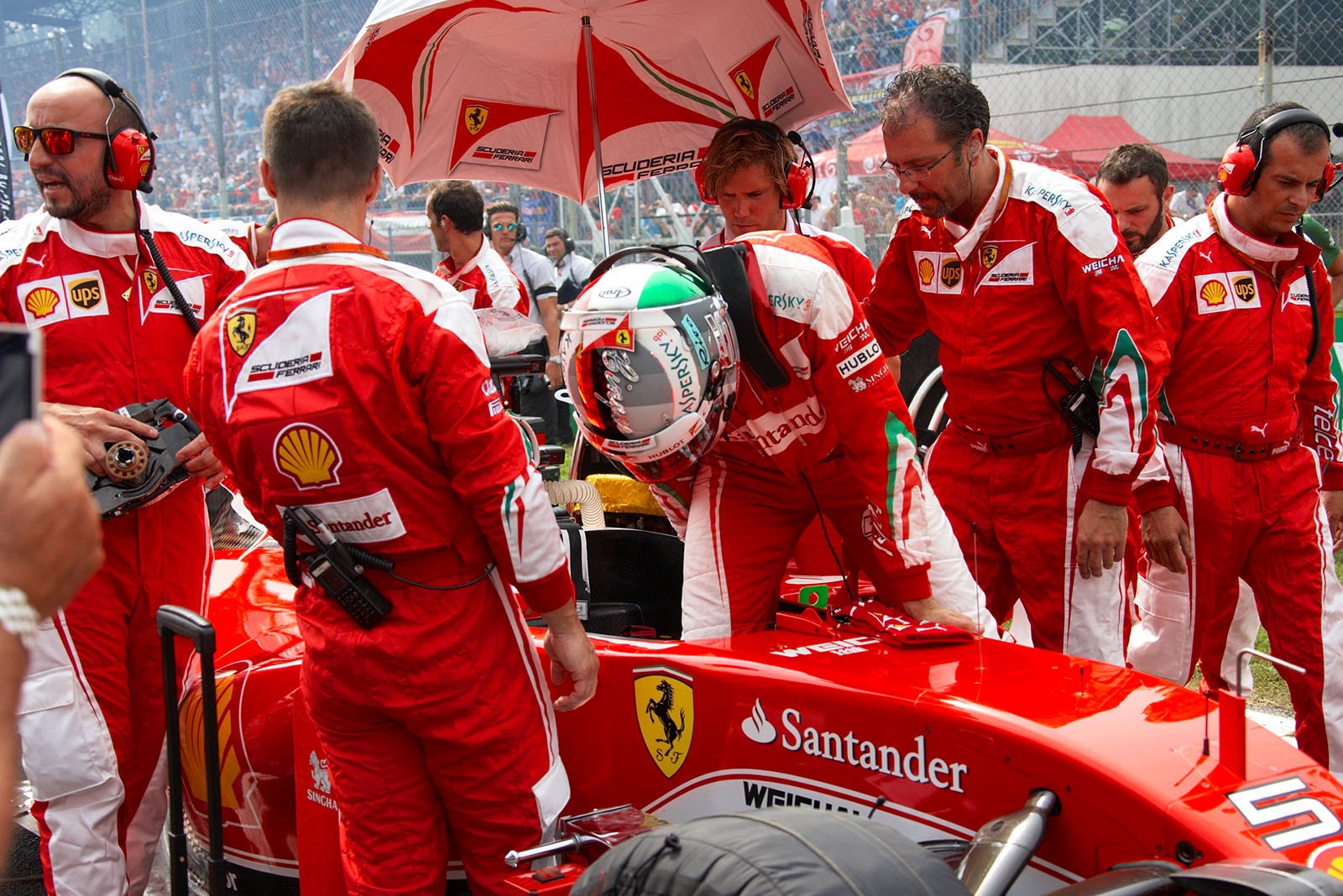 Sebastian Vettel slips into his Ferrari, Monza, Italian Grand Prix, 2016