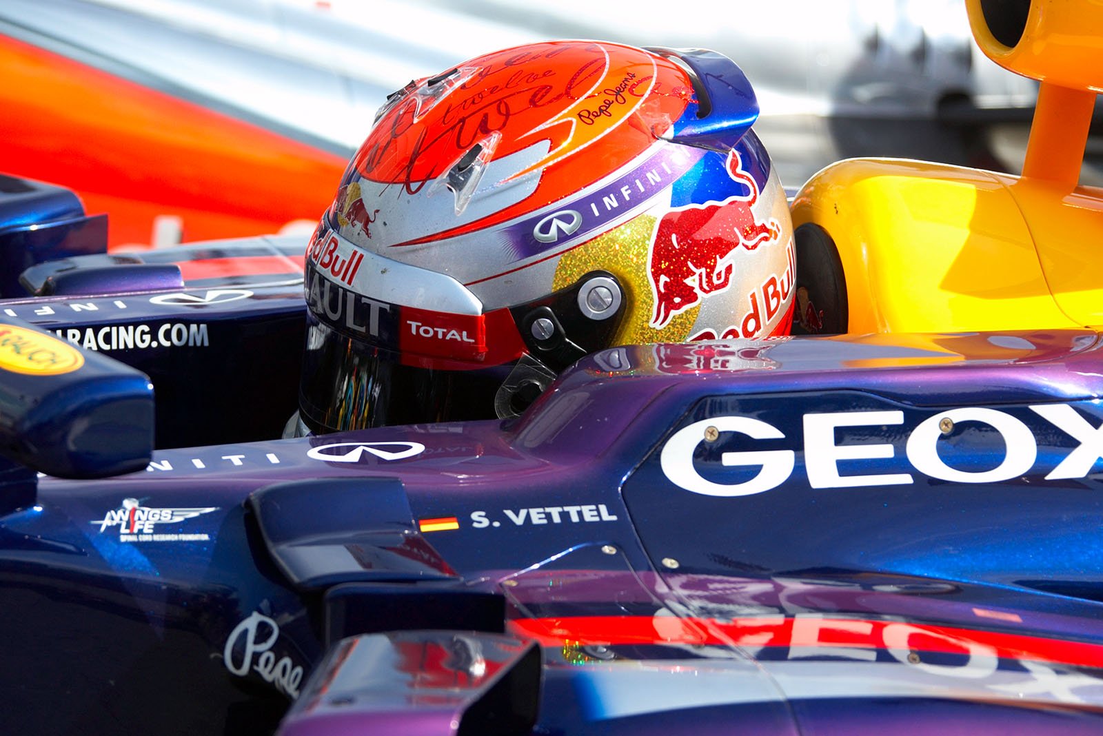 Polesitter Vettel arrives after qualifying in parc ferme