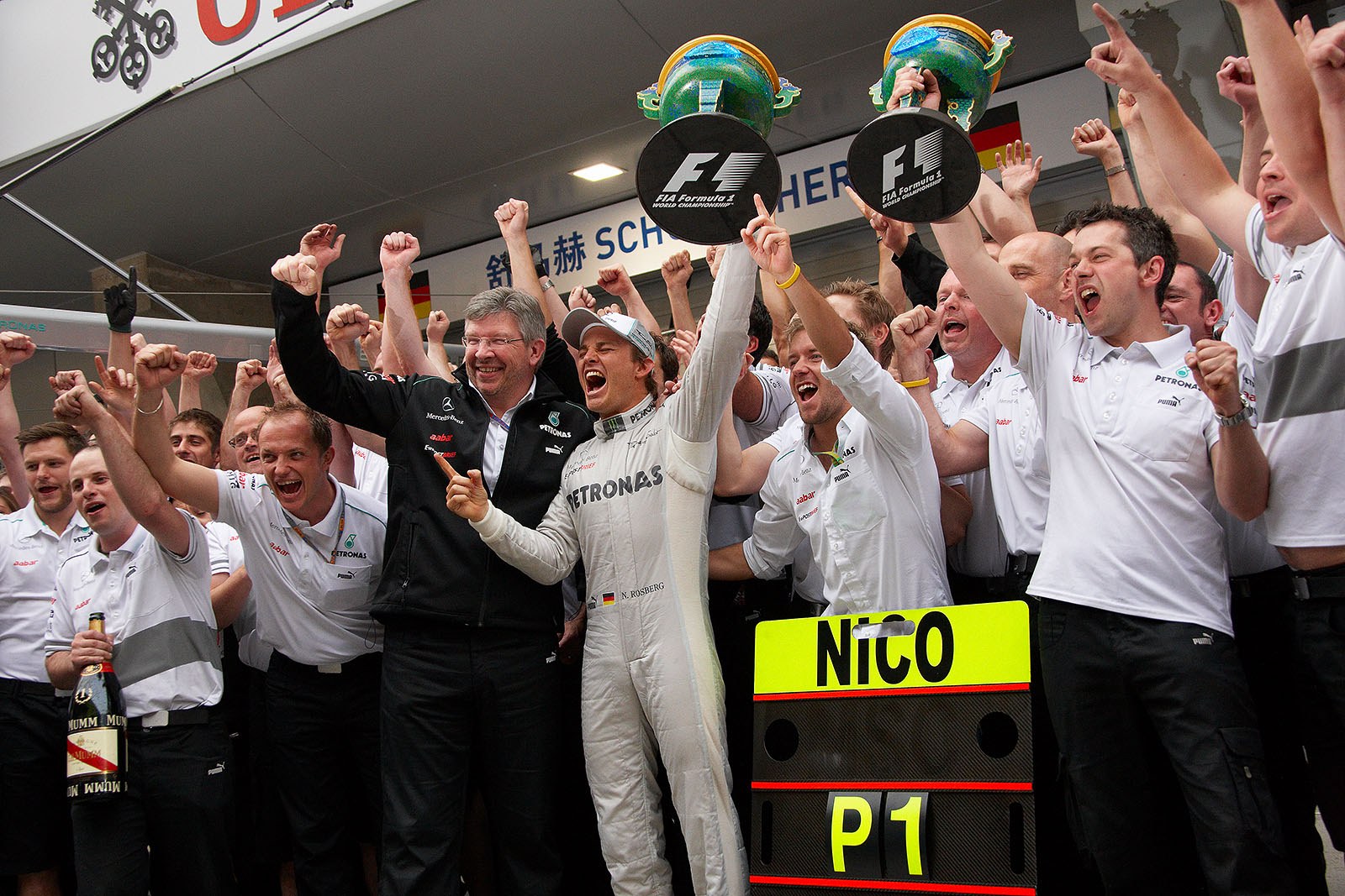 The Mercedes Grand Prix team celebrates Rosberg's fantastic victory - Nico Rosberg runs his 111th race and scores the first Grand Prix win for Mercedes as a works entity since 1955