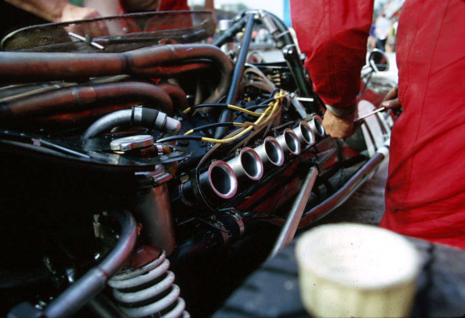 BRM mechanics work at the engine of John Surtees' BRM P139