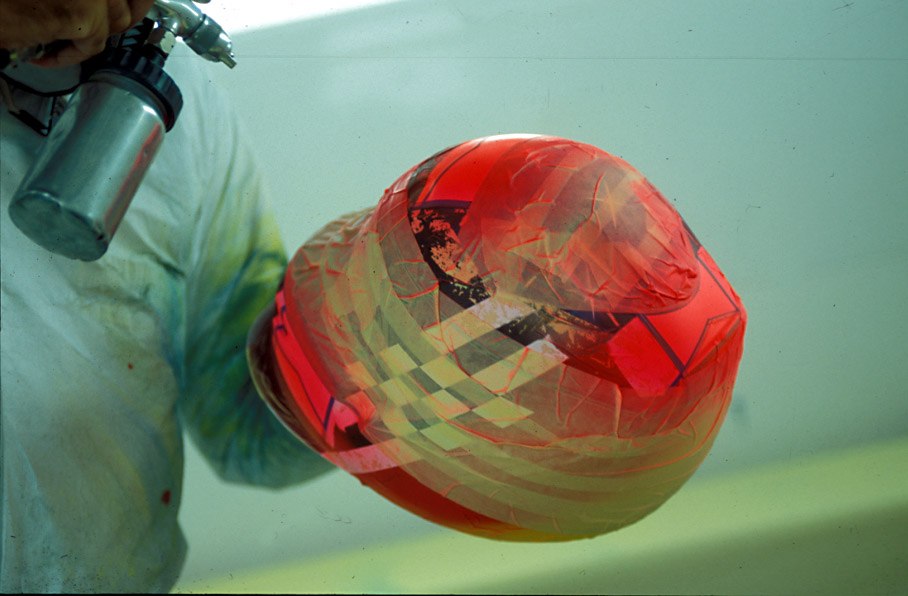 Peter Ginneken of BELL Helmets S.A. making the artwork of the 1998 Suzuka race helmet for Michael Schumacher
