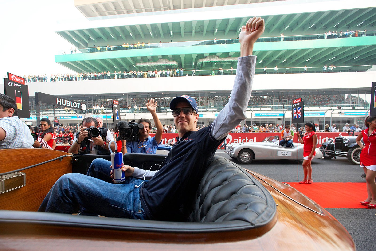 Jean-Michel with Sebastian Vettel for the fans on the stands during the drivers parade