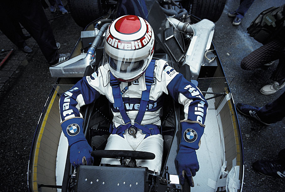 Nelson Piquet sits in the open cockpit of a 1.5 t/c Brabham BT54-BMW 4