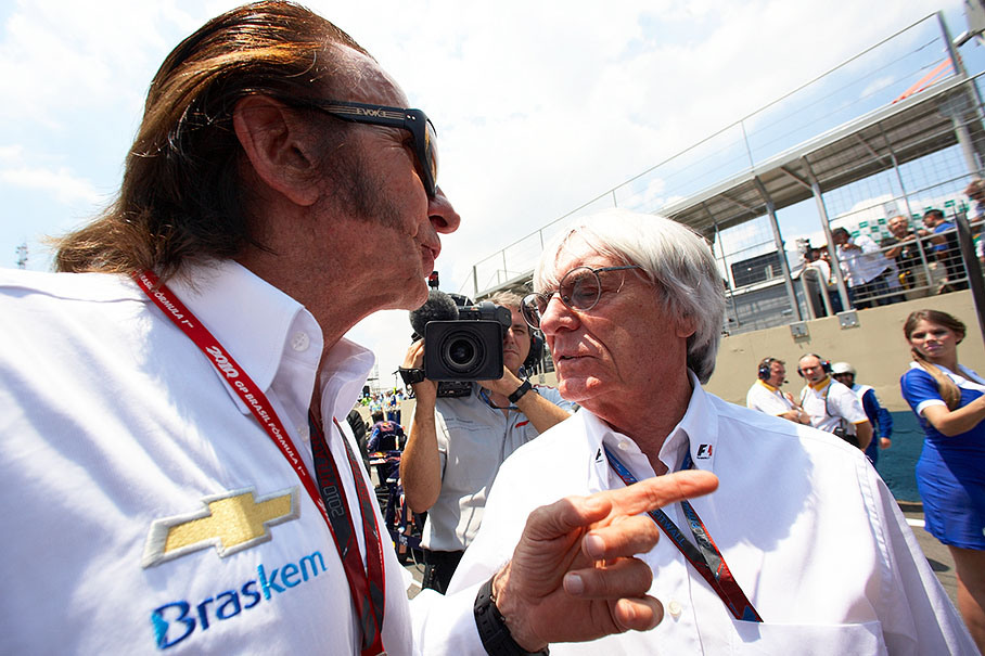 Formula One promoter Bernie Ecclesone chats on the grid with the legendary Brazilian F1 champion Emerson Fittipaldi