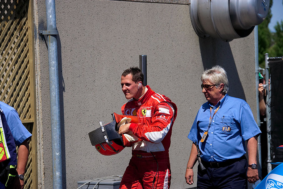 Michael Schumacher and FIA observer Herbie Blash in parc fermé