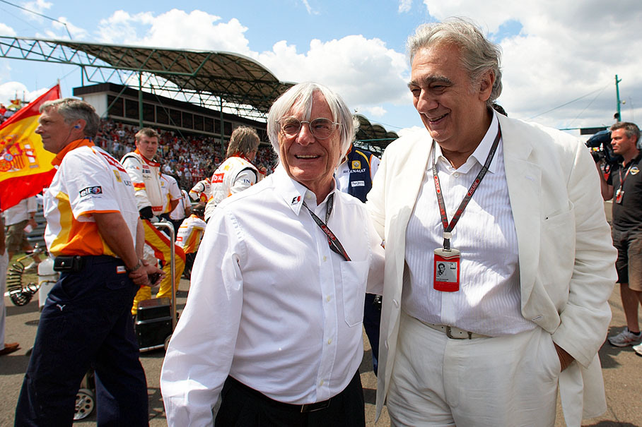 Bernie Ecclestone and world star Placido Domingo watch the busy grid