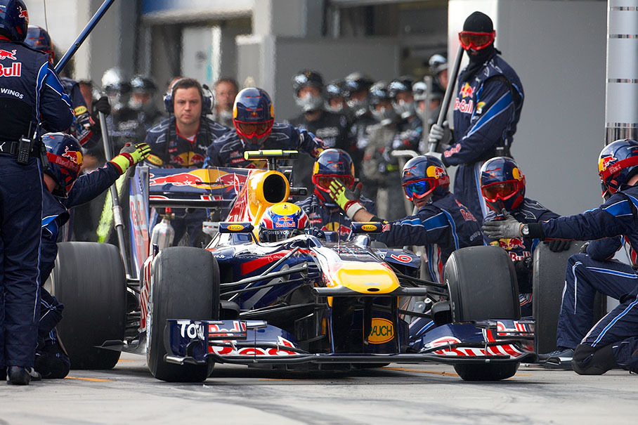 Third placed Mark Webber ejects from Red Bull pits with a new front wing attached