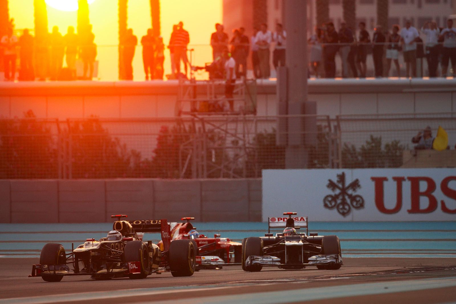 Later race winner Kimi Raikkonen, Lotus F1 team, in front of Williams' Maldonado and Alonso of Ferrari