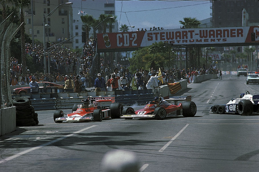 James Hunt' McLaren (No. 1), Carlos Reutemann's Ferrari (No. 12) and Ronnie Peterson's Tyrrell (No. 3) at a start incident.