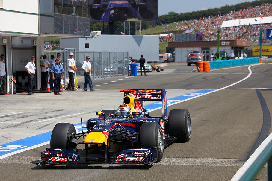 Sebastian Vettel pits to serve his drive-through penalty