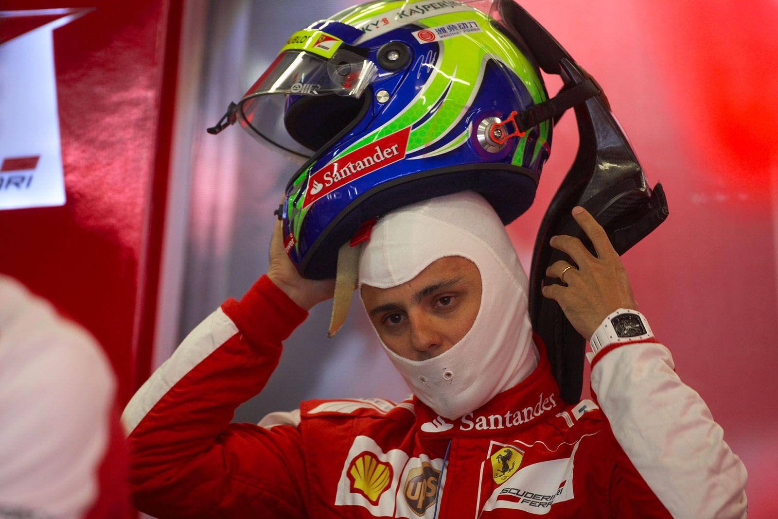 Felipe Massa prepares for a practice session in Ferrari pits