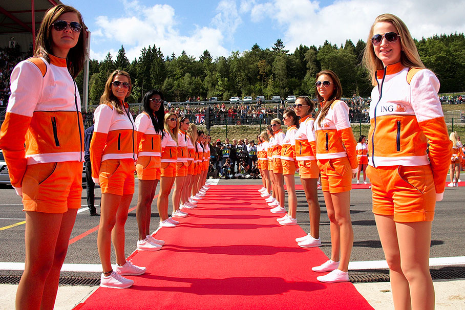 The grid girls wait in formation for the drivers at drivers parade