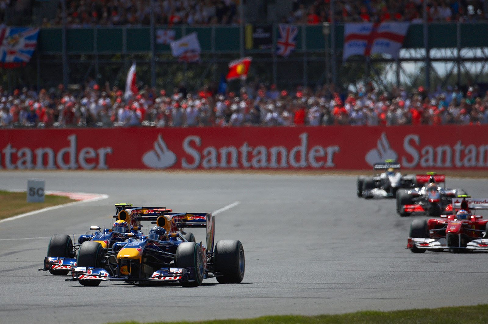 Sebastian Vettel ends his formation lap still in front of Red Bull Racing team mate Mark Webber