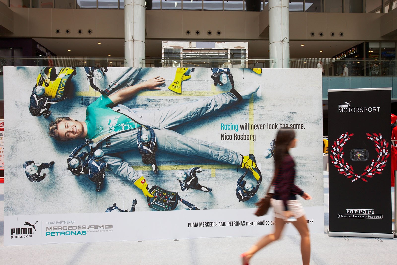A Gulliver-like Nico Rosberg advertises at the race track