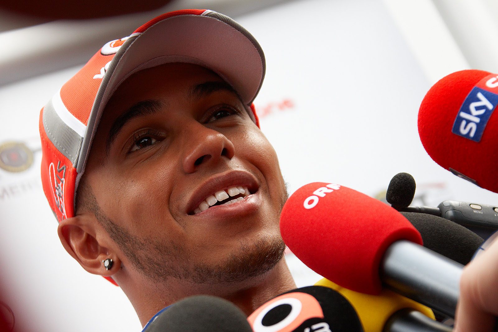 Lewis Hamilton gives interviews to eager media representatives