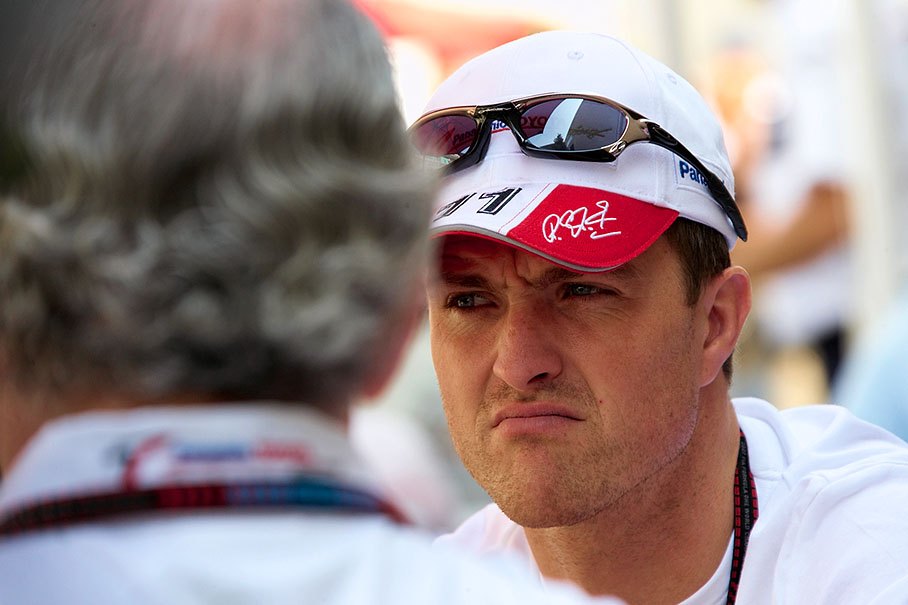 Ralf Schumacher speaks with Toyota team manager Richard Cregan