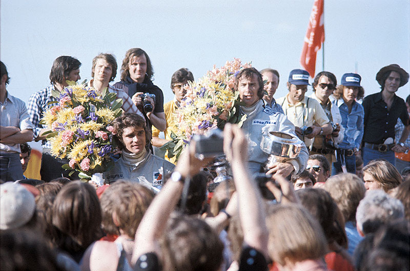 Race winner Jackie Stewart celebrates on podium with second placed Tyrrell team mate Francois Cevert after the Belgian GP Zolder 1973
