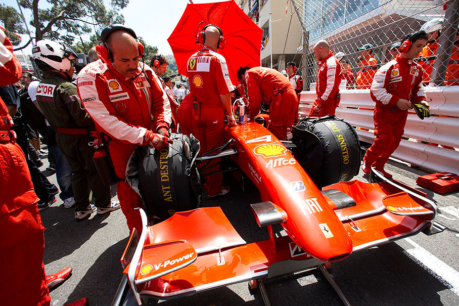 Kimi's Ferrari is being prepared on the grid